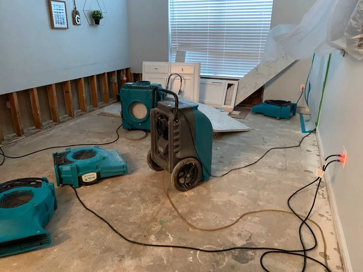 Dehumidifier in flood-cut room for Water Damage Restoration in Mitchellville
